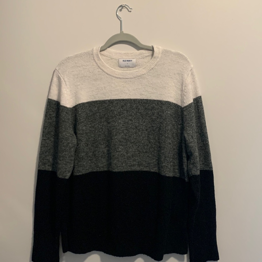 A black, gray, and white sweater from old navy. Worn only twice. Good condition
